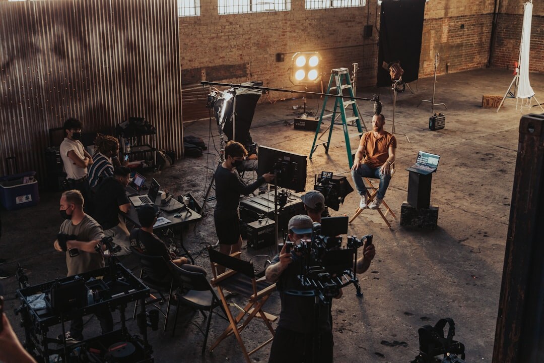 Professional video camera and sound equipment laid out before a shoot
