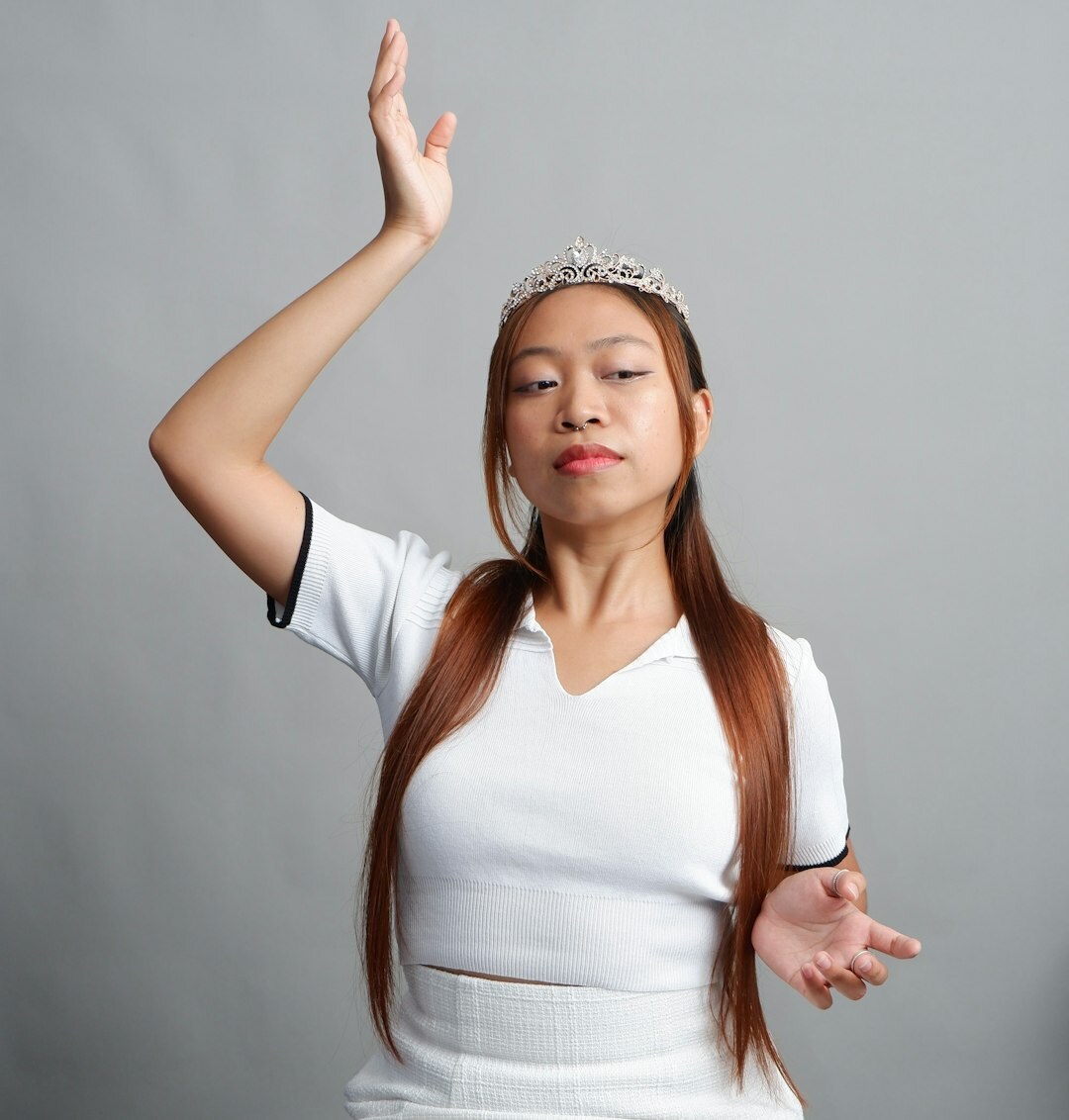 Studio portrait of a young live broadcast instructor woman