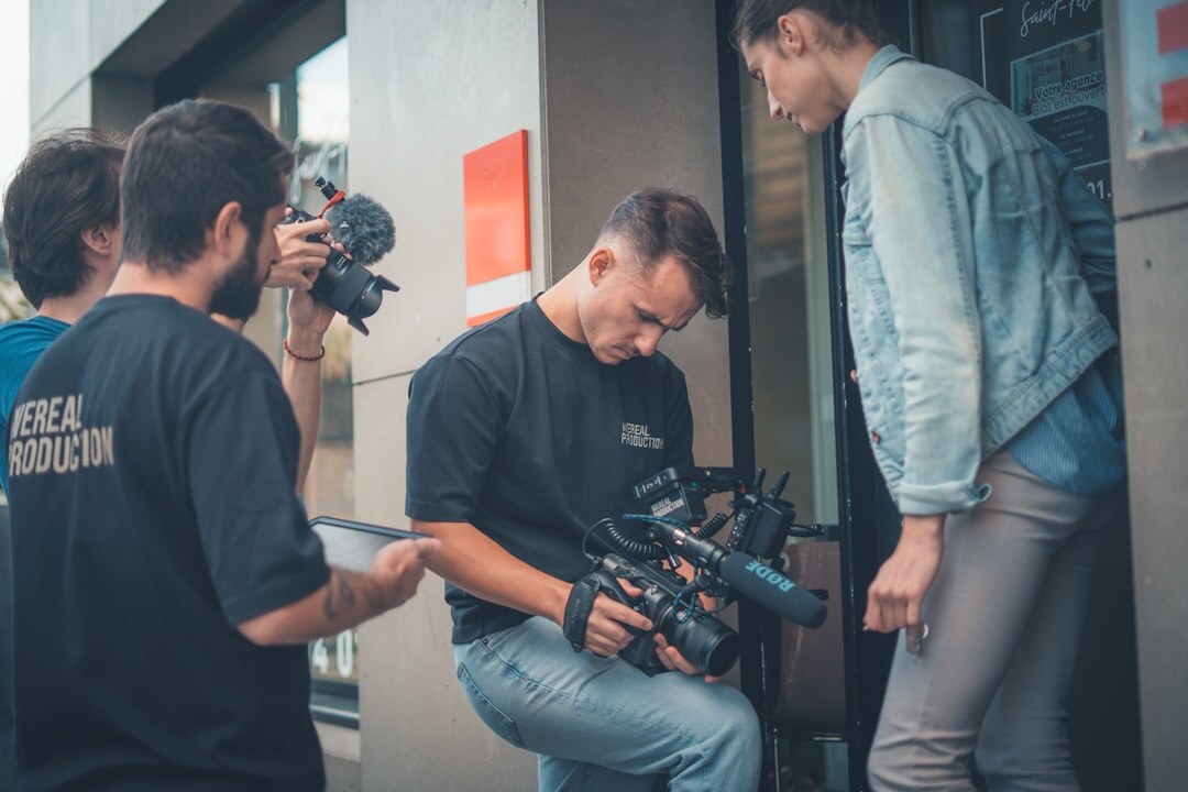 Camera crew filming an interview on location during a news assignment